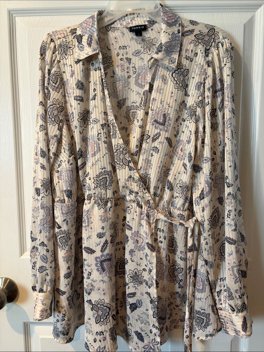 torrid cream floral wrap blouse with navy and blush motifs